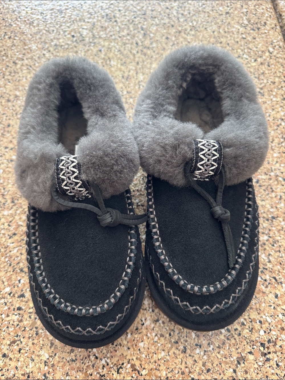 UGG Women's Black Suede Moccasin Slippers with Gray Shearling Trim